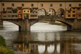 Florence, Italy: ponte vecchio - the famous bridge with its small shops over Arno river is one of the most famous tourist attractions in the city