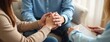 © miss irine - Couple holds hands, talking with psychiatrist. Husband encourages wife suffers depression, psychological problem. Hand in hand together, trust, care. Mental health care, save divorce, serious