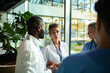 © Marko Geber - Medical team discussing patient care in a modern hospital