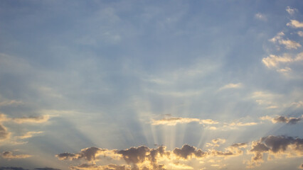 Wall Mural - sunset sky with clouds and sunbeams. nature background.
