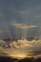 Wall Mural - sunset sky with clouds and sunbeams. nature background.