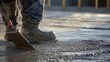© Bhait - A close-up of a concrete finisher smoothing out freshly poured concrete on a commercial building floor, Commercial construction scene, Concrete finishing mastery style