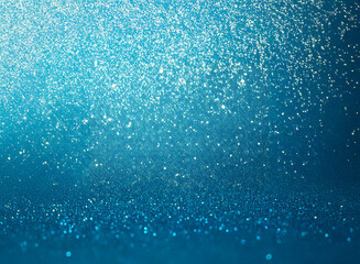 Poster - a dazzling blue glitter background creates a sense of magic and celebration. the shimmering particle