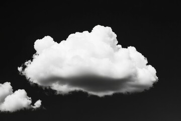 Solitary fluffy white cumulus cloud stands out against a dark sky, cloudscape use