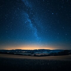 Wall Mural - a clear, starry night sky above a peaceful countryside landscape