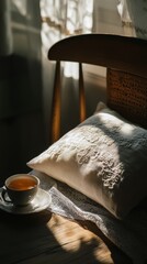 Canvas Print - Sunlit cozy corner with lace pillow and cup of tea on wooden chair