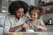 © Vadym Hunko - Smiling African-American mother and daughter baking together in a modern kitchen, mixing ingredients in a bowl, enjoying a joyful bonding moment during a home cooking activity.