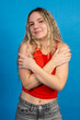 © EDUARDOIVAN - Young woman embracing herself with confidence