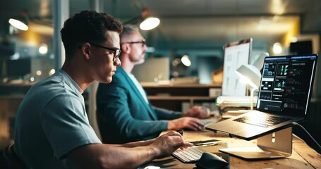 Laptop, typing and business man programming, machine learning or software development. Coding, computer and person writing data, update algorithm or app with ai engineer in creative startup at night