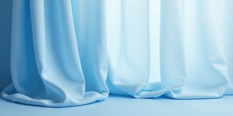 Poster - Serene Light Blue Drapery Creates a Soft and Elegant Background for Product Displays or Artistic Compositions