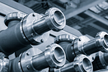 Poster - A close up of a group of metal pipes as industrial background. pipes are silver and have a shiny appearance. Concept of industrial Chemical pharmaceutical device