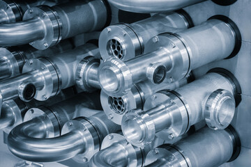 Poster - A close up of a group of metal pipes as industrial background. pipes are silver and have a shiny appearance. Concept of industrial Chemical pharmaceutical device