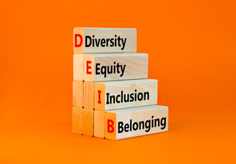 Wall Mural - DEIB diversity equity inclusion belonging symbol. Concept words DEIB diversity equity inclusion belonging on blocks. Beautiful orange background. Business diversity equity inclusion belonging concept.