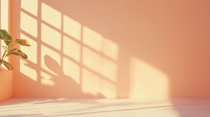 Wall Mural - soft peach colored wall with sunlight streaming through window, casting grid like shadows, and green potted plant in corner creates serene and minimalistic atmosphere