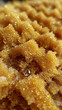 © Anatolii - Macro shot of golden, glistening beads, creating a textured, abstract background.  Perfect for concepts of luxury, richness, or scientific research.