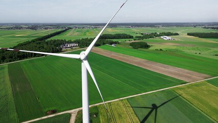 Wall Mural - Wind turbine symbolizing sustainable future in rural landscape