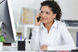 © auremar - happy female office worker on the phone