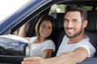 © auremar - portrait of smiling man and woman in car