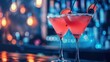 © N Joy Art  - Vibrant cocktail bar with glowing red drinks in martini glasses. Soft ambient lighting and blurred background create a lively nightlife setting, creativity and high-tech interactive experience.
