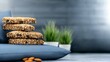 © Jirakit - Homemade granola bars with nuts and dried fruits on a plate.