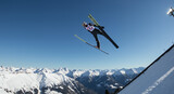 Ski Jumper Flying Through the Air in Winter Sports.