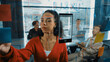 © Summit Art Creations - Portrait of hispanic businesswoman present start up marketing idea to investor. Female leader present brainstorming business plan written on sticky notes on glass wall at business meeting. Manipulator