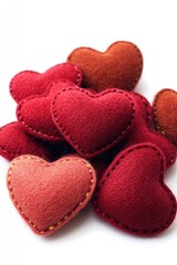 Wall Mural - A collection of bright red felt hearts stacked together, often used as decorations or gifts