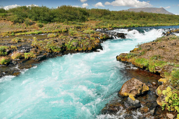 Wall Mural - Blue waterfall and rapids on the river in Iceland