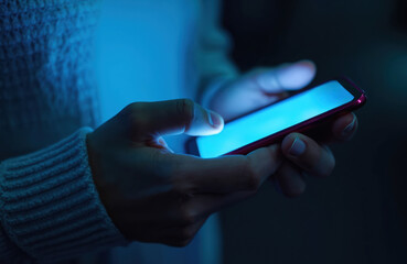Poster - Hands hold smartphone in blue light in darkness. Finger touches device screen. Mobile phone glows. Social media, cyberspace communication. Modern digital tech contraption. Online browsing, texting.