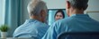 © miss irine - Two elderly patients view video call with doctor. Telemedicine concept, remote healthcare, healthcare tech, virtual care session, online consultation, support for seniors. Advancements in