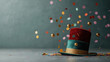 © KM - festive hat with red and teal colors surrounded by colorful confetti and shiny balls creates joyful celebration atmosphere