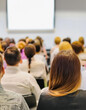© lina - attentive audience watching a presentation in a meeting room