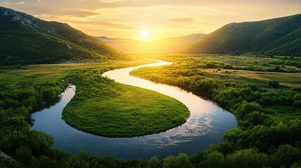 Poster - Serene river winding through lush green valley at sunset creating a peaceful landscape view