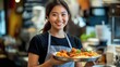 © Pixora Labs - Female waitress serving food in plate smiling