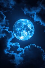 full blue moon shining brightly through dark clouds in a night sky celestial scene