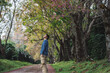 © tickcharoen04 - solo traveler in nature concept with asian man camping and sightseeing with pink cherry blossom tree in springtime season