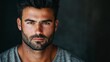 © Andrew - Intense Gaze: A portrait of a handsome man with dark hair and beard, his intense gaze captivating the viewer against a dark background.