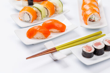 Poster - Assorted sushi and maki rolls beautifully arranged on plates