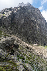 Wall Mural - Sharp rocky mountain peak above Passo Paschiet mountain pass in Graian Alps in Italy