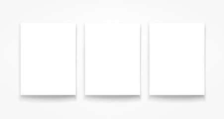 Poster - Three blank portrait frames on the wall. 3d vector mockup