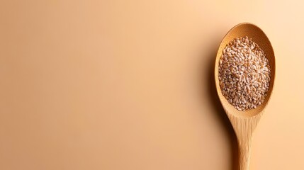 A wooden spoon filled with sesame seeds on a soft, neutral background, ideal for culinary blogs, health articles, or cooking websites focused on healthy ingredients and recipes,