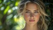 © Adobe - Close-up portrait of a young woman with blonde hair and blue eyes, outdoors.