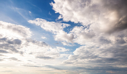 Poster - Gorgeous and spectacular vivid clouds illuminated by the rays of the sun.