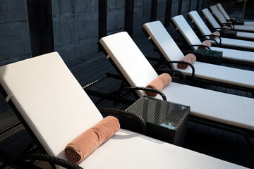 Wall Mural - Swimming pool in a luxury hotel. Deckchair and towel. Hue. Vietnam.