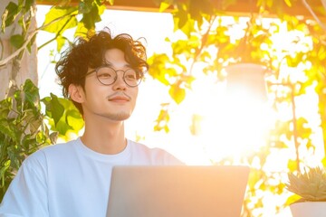 Poster - Sunlit Green Workspace Young Asian Entrepreneur with Laptop and Coffee in Outdoor Urban Nature Setting - Remote Work Trends and Wellness-Focused Office Solutions