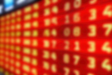 Canvas Print - A close-up view of a vibrant, illuminated electronic scoreboard displaying numbers in various colors and sizes, creating a dynamic visual effect.