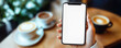 © Bartek - Mockup of Woman Hand Holding Mobile Phone with Blank Screen in Coffee Shop for Social Media Marketing
