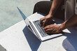 © Westend61 - Freelancer using laptop on sunny day in park