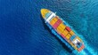 © A4719 - High angle view of a large cargo ship sailing across a body of water. The ship is brightly colored with containers of varying shades of yellow