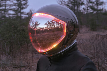 Poster - A dreamlike convergence of technology and nature: an astronautâ€™s face shield reflecting serene